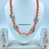 Orange Beads And Silver Rose Beads With Silver Twisted Leaf Oxidized Necklace