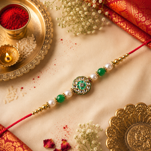 Red Thread, Pearl And Green Beads With Round Green Kundan Rakhi