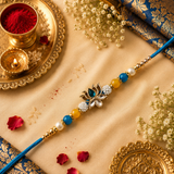 Blue Thread, Blue, Yellow And Pearl Beads With Lotus Kundan Rakhi
